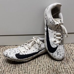 Black and White Nike track spikes
